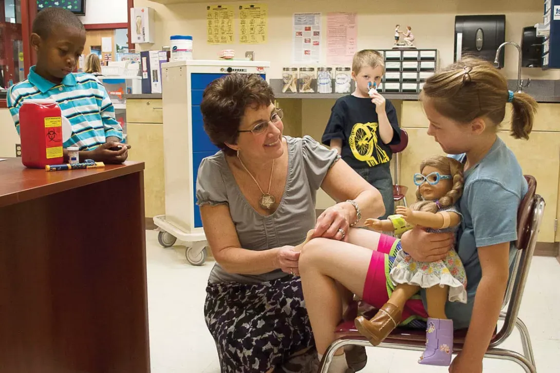 school nurse helping a student